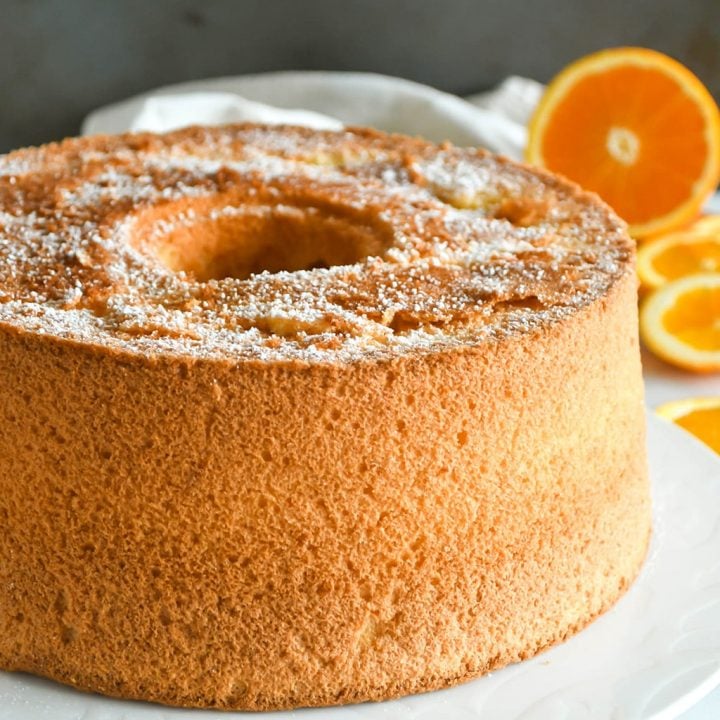 Orange chiffon cake whole, on a serving plate