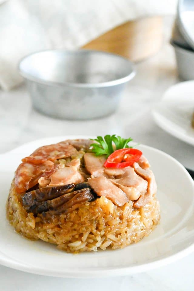 loh ma kai (steamed glutinous rice with chicken) on a plate
